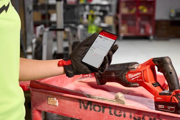 Worker scanning a Sawmill with the One-Key app.