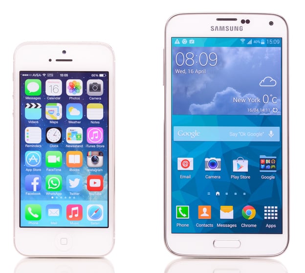 Apple iPhone beside larger Samsung Galaxy smartphone