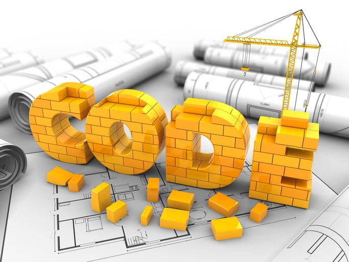 Building codes graphic shows word code made of lego on top of construction plans