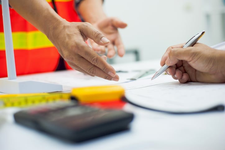 Businessmen and contractors sign a joint construction project agreement