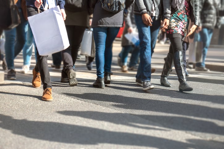 Busy street filled with commuters and shoppers shows walkable city