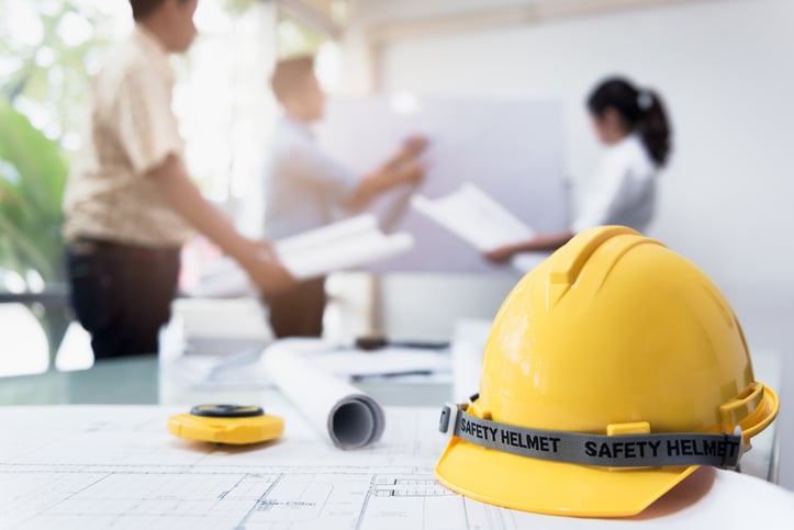 Construction project managers and architects discuss project