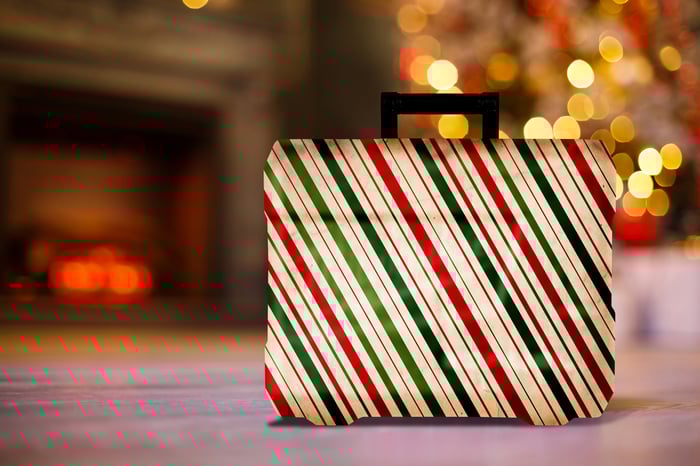 A gift wrapped in green and red paper
