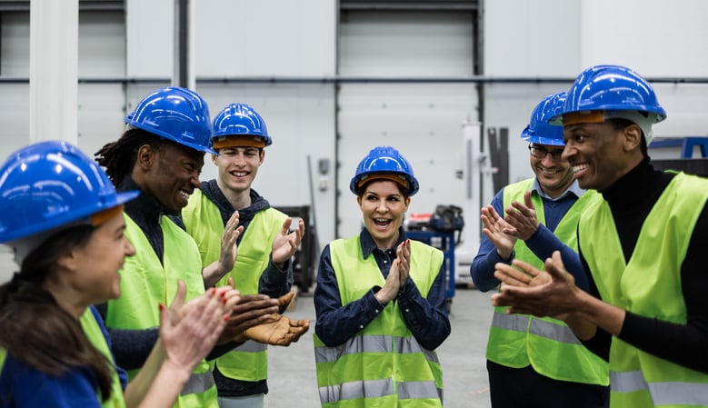 Group of construction workers having a team building meeting