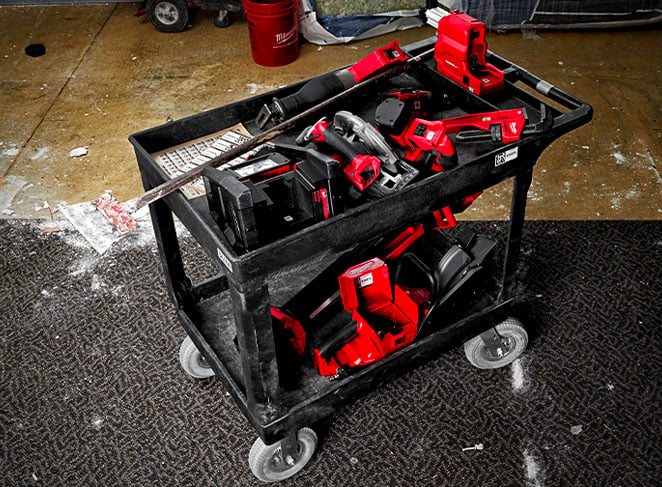A cart of construction tools on a jobsite should be properly cleaned