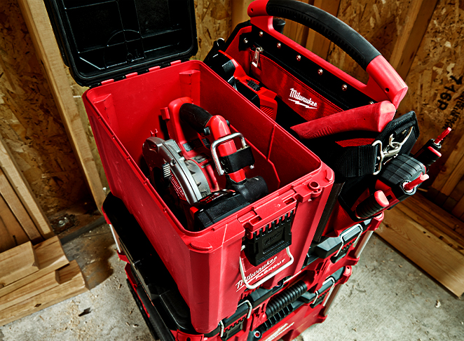 A neat stack of boxes on a construction jobsite hold tools ready to be used