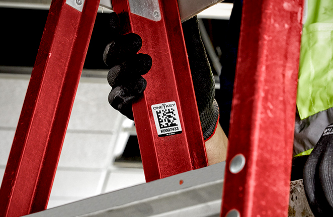 red ladder is tagged with an identification sticker