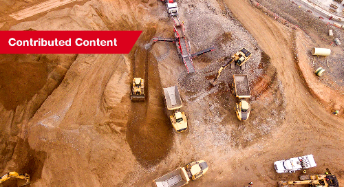 An aerial shot of a jobsite with construction equipment 