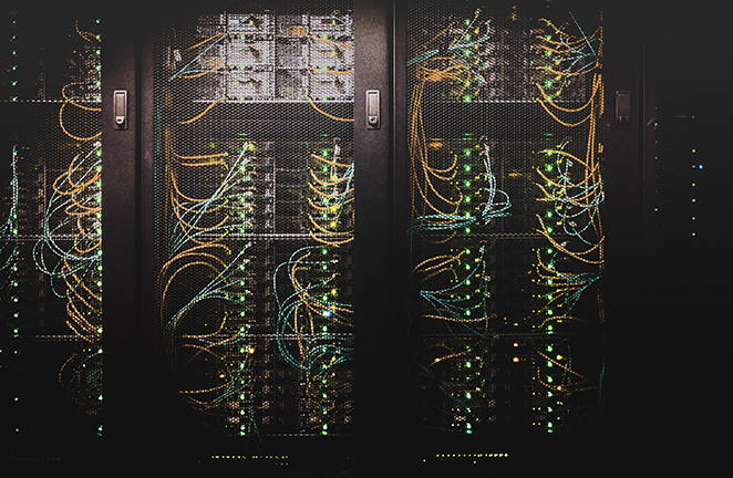 Computer server hardware is caged behind locked doors