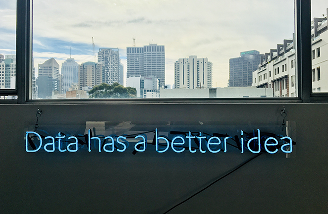 A light up sign reads "Data has a better idea"