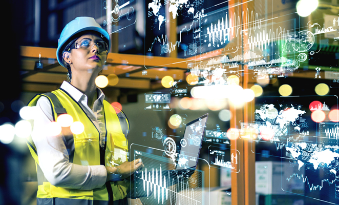 Photo shows construction woman with laptop computer illuminated by data overlay