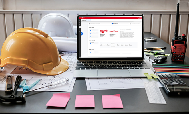 A laptop on a contractor's desk open to the One-Key enterprise inventory management app generating an alerts report