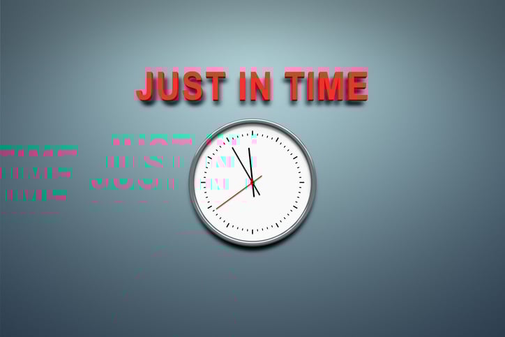 Just in time message sits above a ticking wall clock