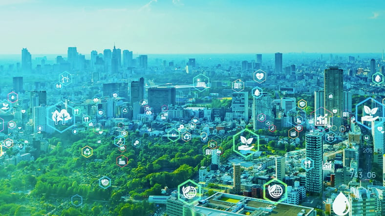 Smart city technology photo shows city surrounded by greenery
