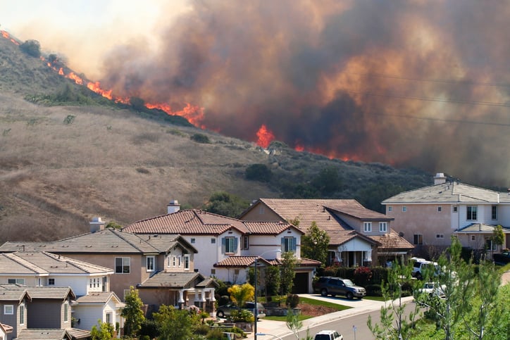 View of wildfires behind California neighborhood