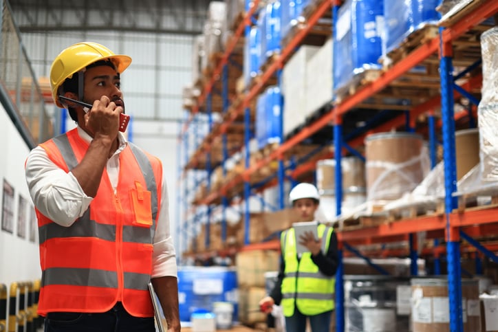 Warehouse or Supply chain engineer work with worker to check inventory