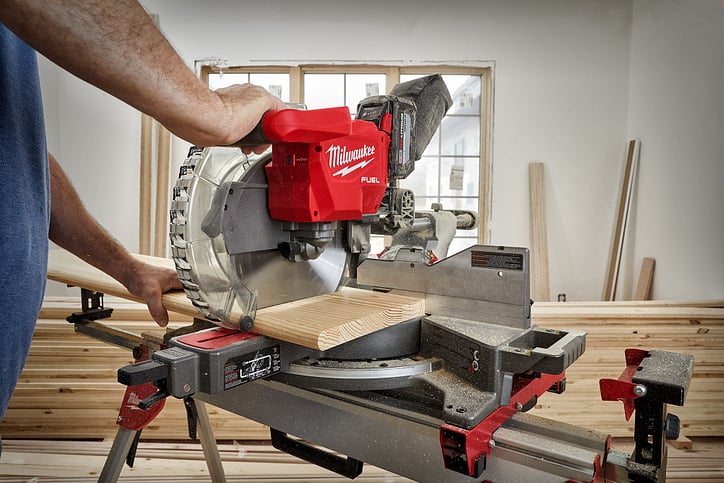 Woodworker operates Milwaukee miter saw