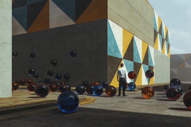 abstract glass spheres next to man and mural