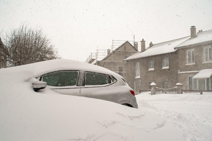 car buried in snow after storm