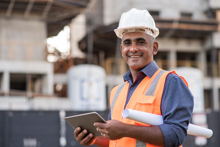 construction-contractor-holding-tablet