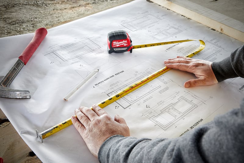 general-contractor-tape-measure-blueprints