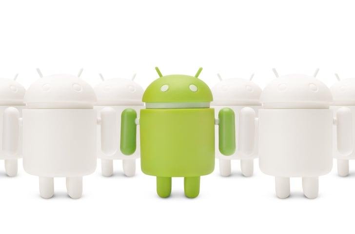 green-google-android-robot-next-to-line-of-white-robots