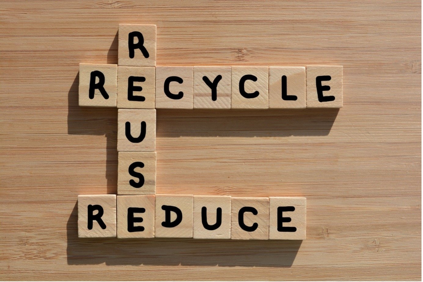 Scrabble tabletop game spells out: "reduce, reuse, recycle"